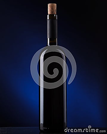 A bottle of wine on a dark background