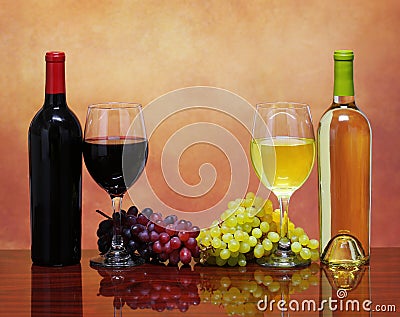Bottles of Red and White Wine with Fresh Grapes