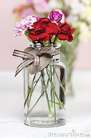 Bouquet of carnation flowers in glass vase