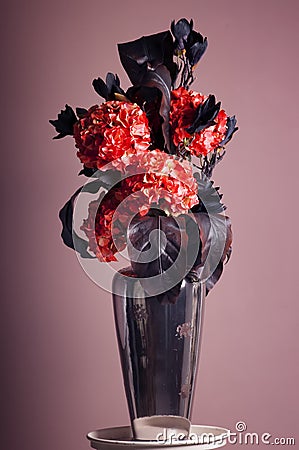 Bouquet of red hydrangea and dark blue magnolia