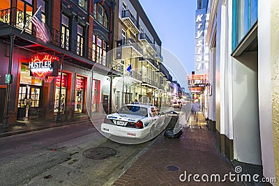 Bourbon street in twilight with police car