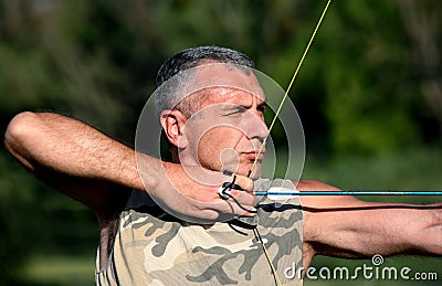 Bowman aiming with bow and arrow