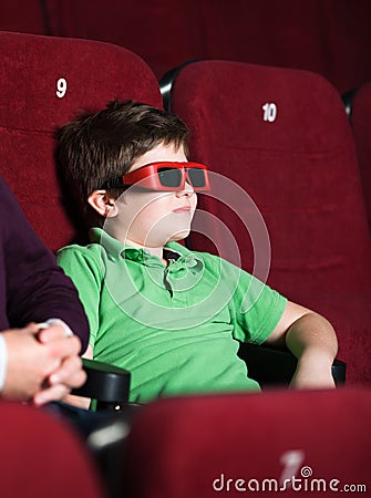 A boy in 3D movie theater