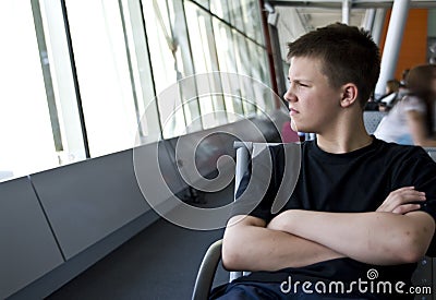 Boy in airport lounge