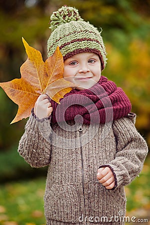 Boy with big leaf