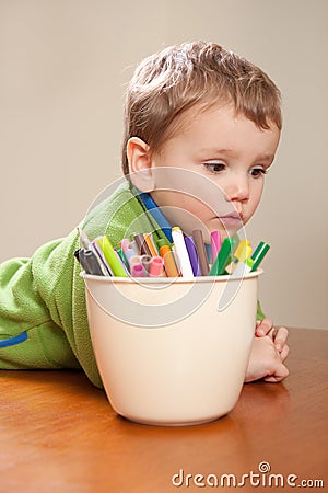 Boy child with kids colored drawing pens
