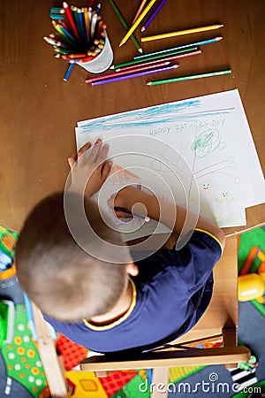 Boy, drawing a picture for fathers day