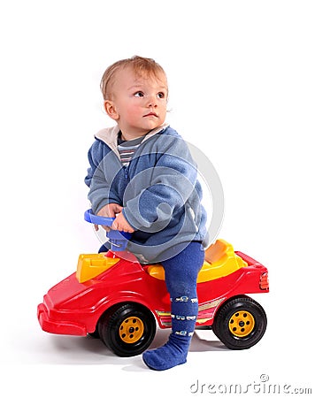 Boy Driving A Red Toy Car Royalty Free Stock