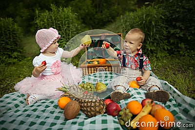 Boy and girl on picnic in park