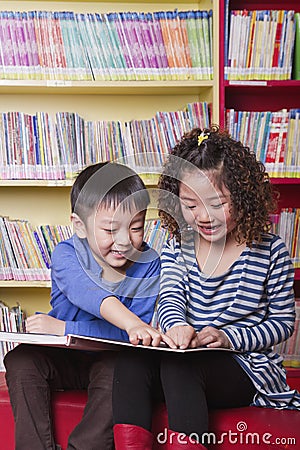 Boy and Girl Reading Together