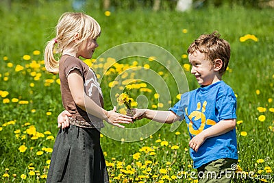 Boy giving flowers for a girl