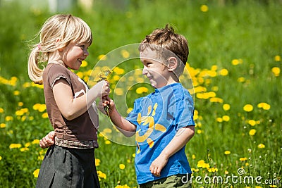 Boy giving flowers for a girl