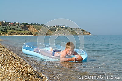 Boy in an inflatable boat