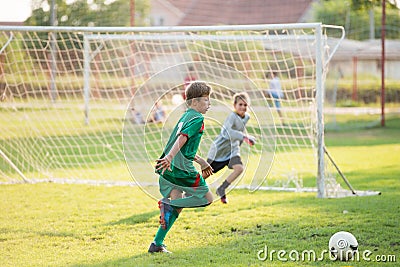 Boy kicking a ball