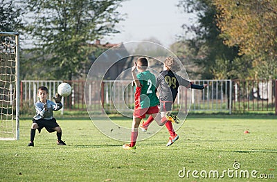 Boy kicking a ball