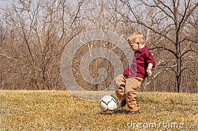 Boy kicking ball