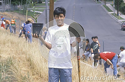 A boy participating in a tree planting