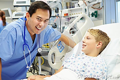 Boy Talking To Male Nurse In Emergency Room