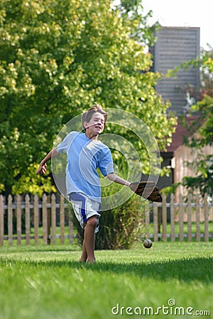 Boy Trying to Catch Ball