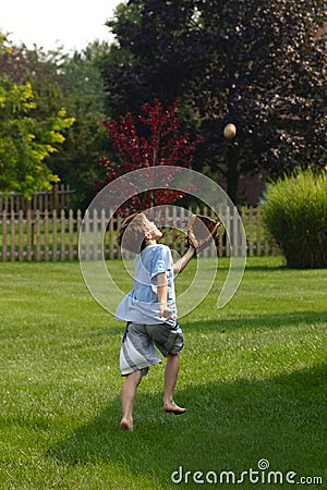 Boy Trying to Catch Ball