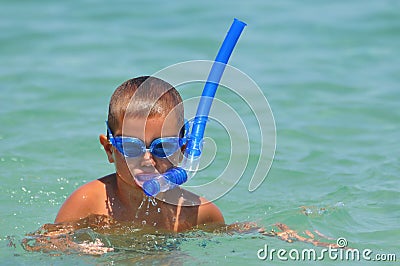 Boy in the water with diving equipment