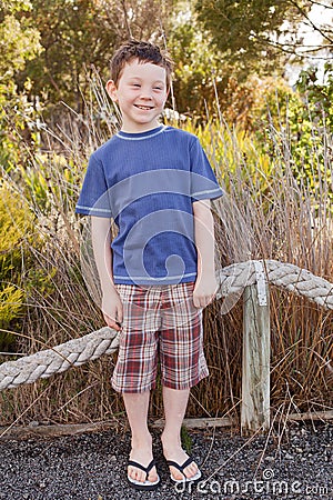 Seven year old boy wearing rubber Flip Flops, also known as Thongs.
