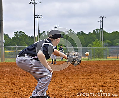 Boys Baseball Catching a Throw