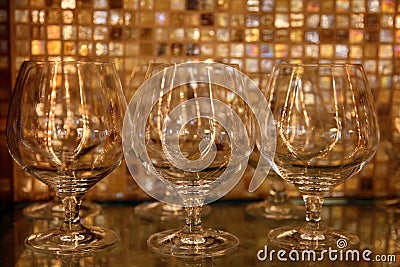 Brandy glasses against restaurant bar background