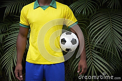 Brazilian Football Player Holding Soccer Ball in Jungle