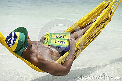 Brazilian Man Relaxing with Brazil Tickets