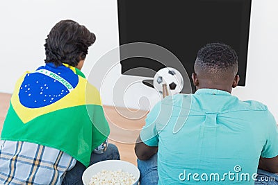 Brazilian soccer fans watching tv