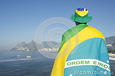 Brazilian Wrapped in Flag at the Sea