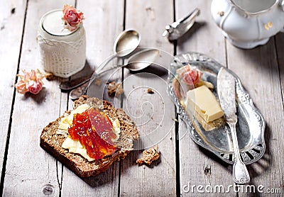 Bread with butter, jam and yogurt