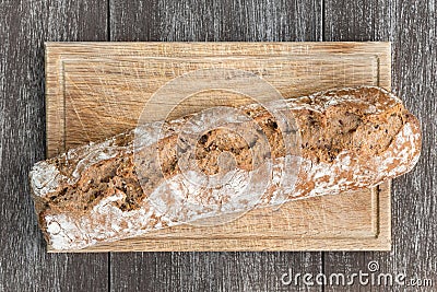 Bread on wooden board and table