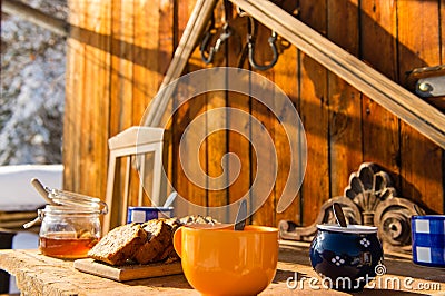 Breakfast wooden table outside winter snow cottage