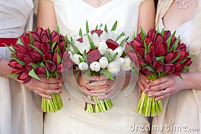 Red and white tulip and rose wedding bouquets