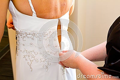 Bride Getting Dress Zipped Up