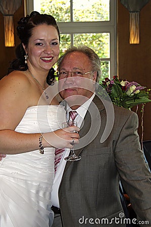 Bride with her dad after marriage ceremony