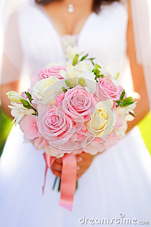 Bride with rose wedding bouquet