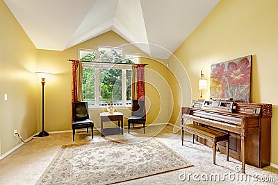 Bright living room with antique piano