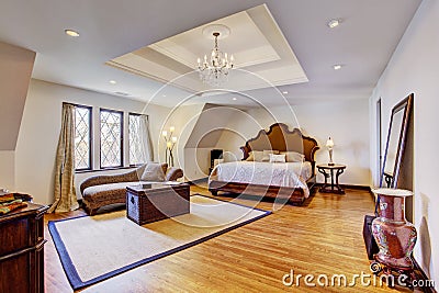 Bright luxury bedroom with design ceiling