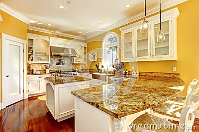 Bright yellow kitchen room with granite tops