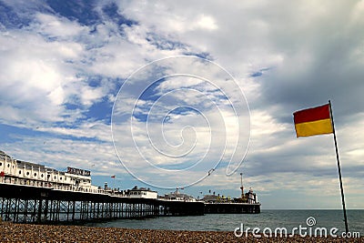Brighton: beach surf rescue flag and pier