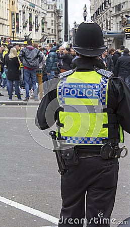 British Transport Policeman watching a crowd