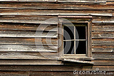 Broken Window on an Old Abandoned Wood House