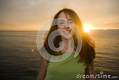 Brunette woman at sunset