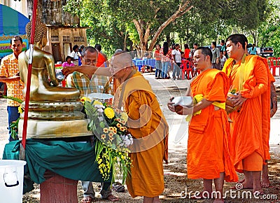 Buddhist monks bathe the Buddha, Songkran festival