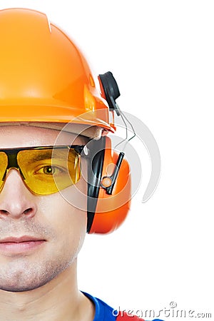 Builder In Hard Hat, Earmuffs And Goggles Royalty Free Stock