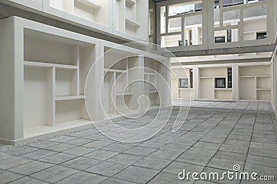 Building facade with square structures. Patio. Interior.