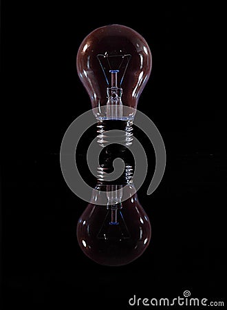 Bulb on a black background with reflection